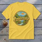 Yellow t-shirt with circular Pennsylvania landscape graphic featuring a deer.