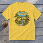 Yellow t-shirt with "Maryland" text above a circular landscape with a deer.