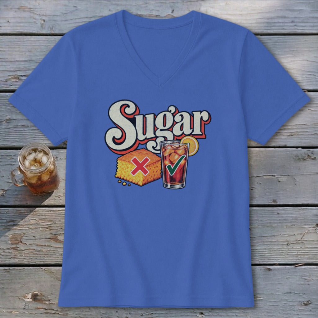 A blue V-neck t-shirt featuring a retro graphic with the text "Sugar," a cornbread slice with a red X, and a glass of iced tea with a green checkmark.