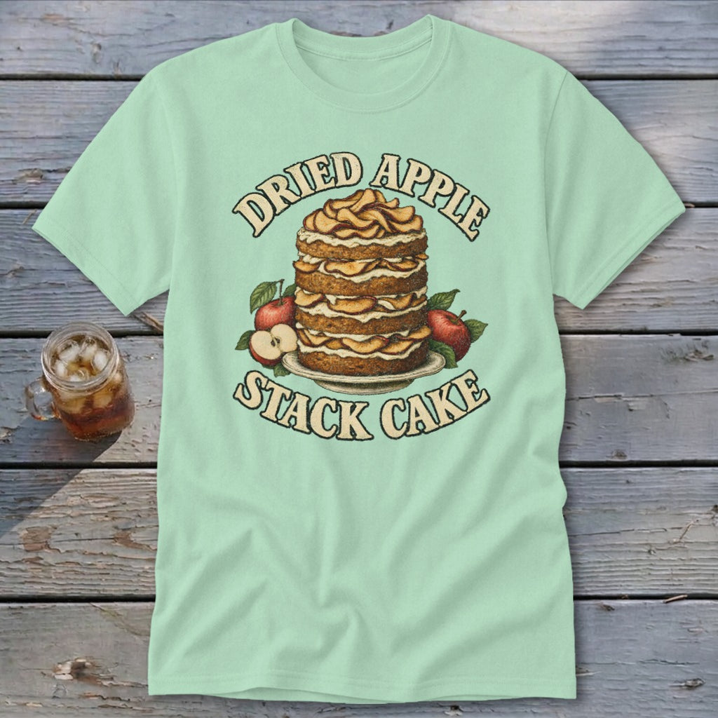 Light green t-shirt with a dried apple stack cake and apples graphic and text.