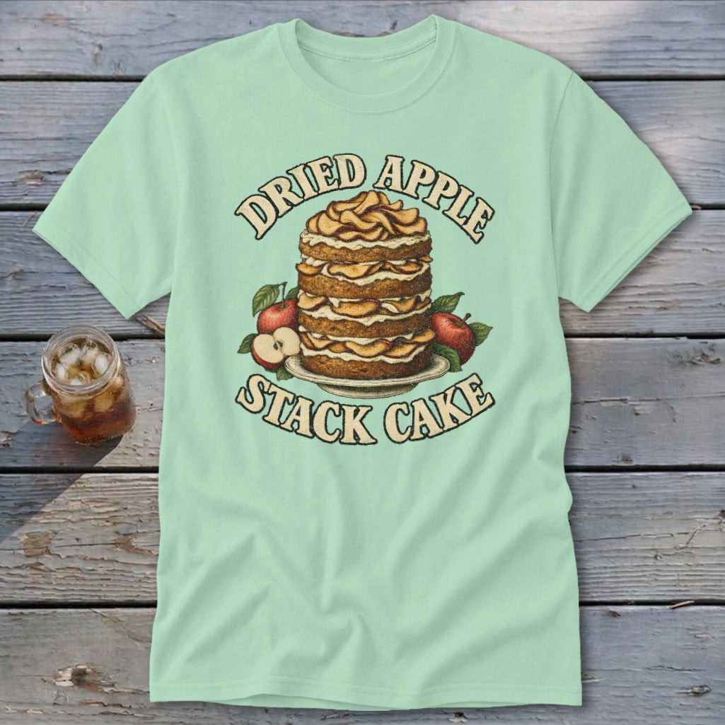 Light green t-shirt with a dried apple stack cake and apples graphic and text.