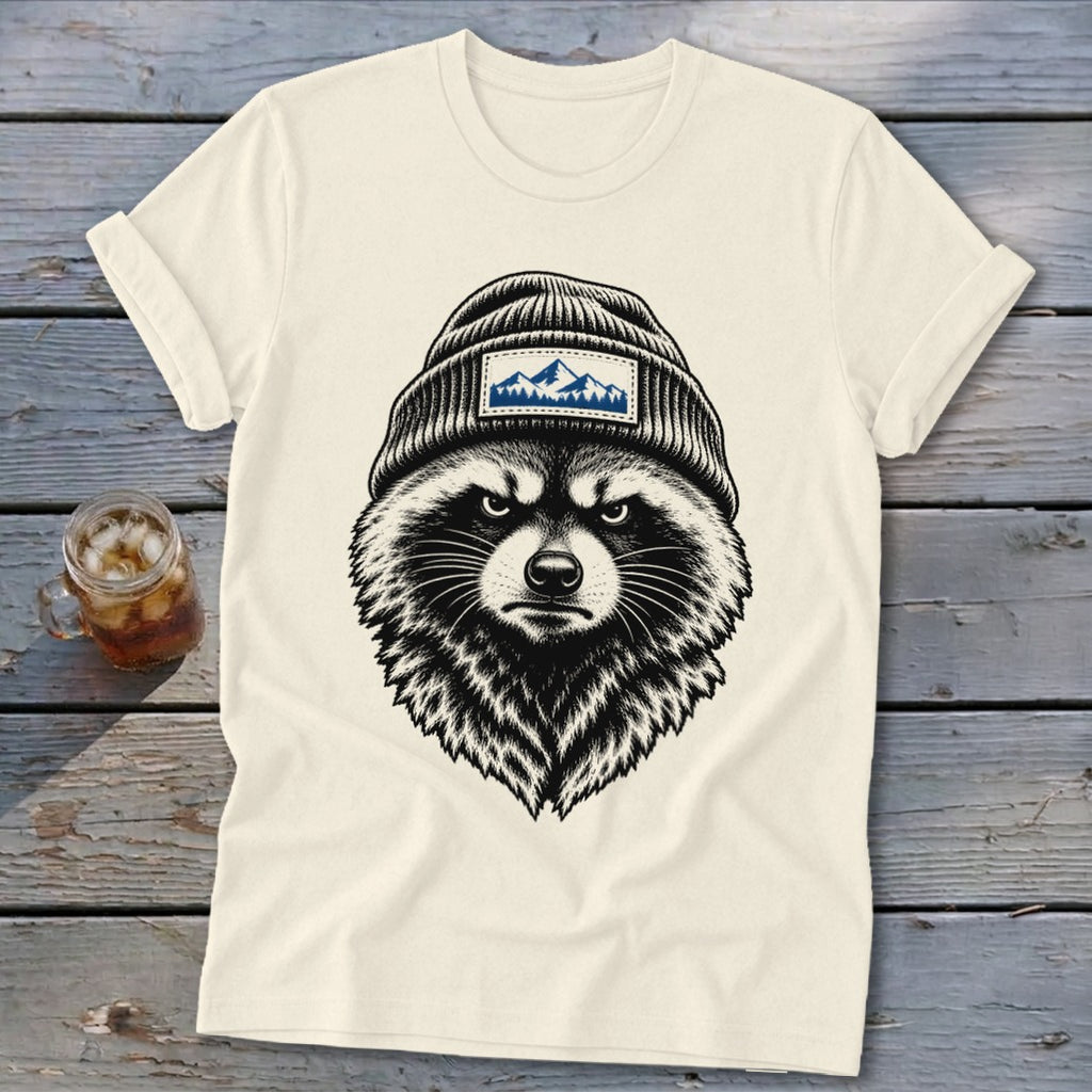 Graphic tee with a black and white illustration of a raccoon wearing a beanie with a mountain patch.
