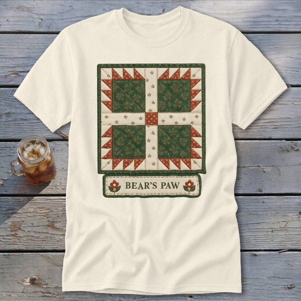 Cream t-shirt with a green, red, and white quilt block design and "BEAR'S PAW" text.