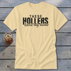 Yellow t-shirt with black text "THESE HOLLERS know my name".