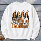 White sweatshirt with graphic of four baying dogs and the text "holler".