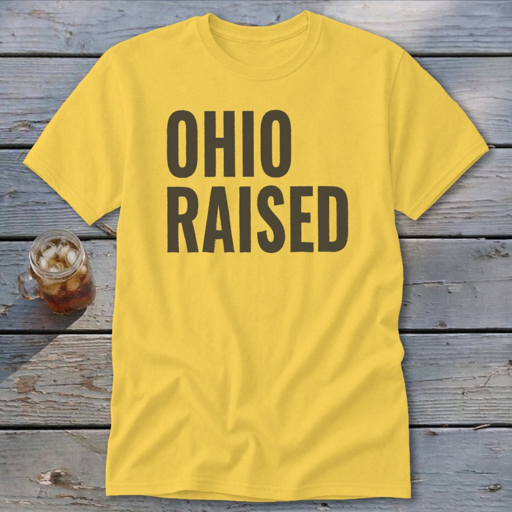 Yellow t-shirt with "OHIO RAISED" text in dark gray, next to a glass of iced tea.