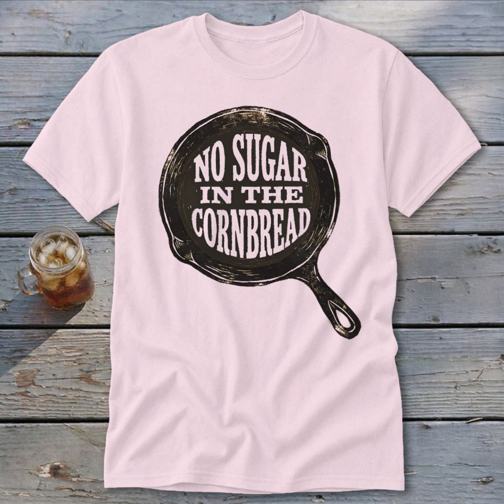 Light pink t-shirt with "NO SUGAR IN THE CORNBREAD" text inside a skillet graphic.