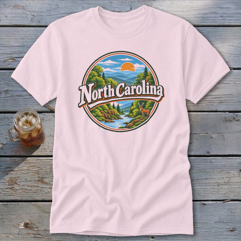 Pink t-shirt with North Carolina mountain landscape and deer graphic.