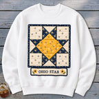 White sweatshirt with an Ohio Star quilt pattern and yellow floral accents.