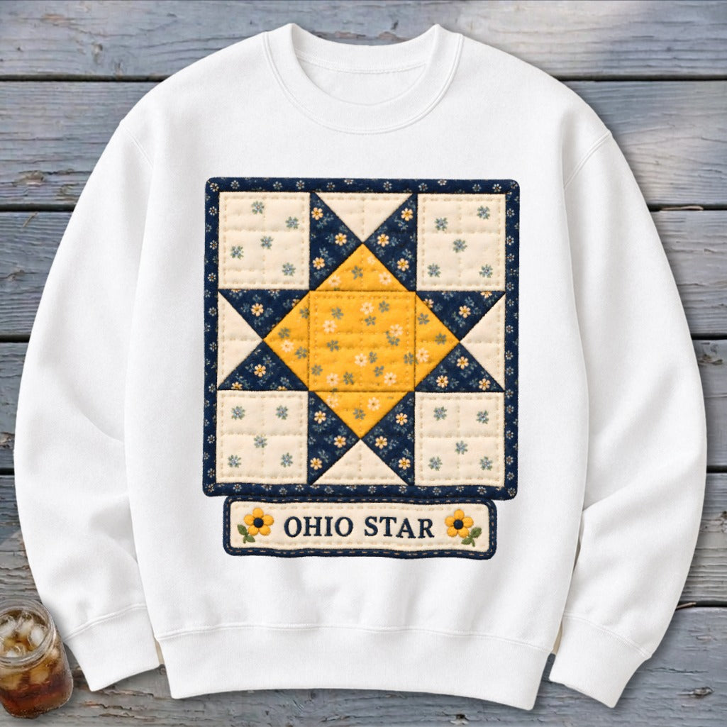 White sweatshirt with an Ohio Star quilt pattern and yellow floral accents.