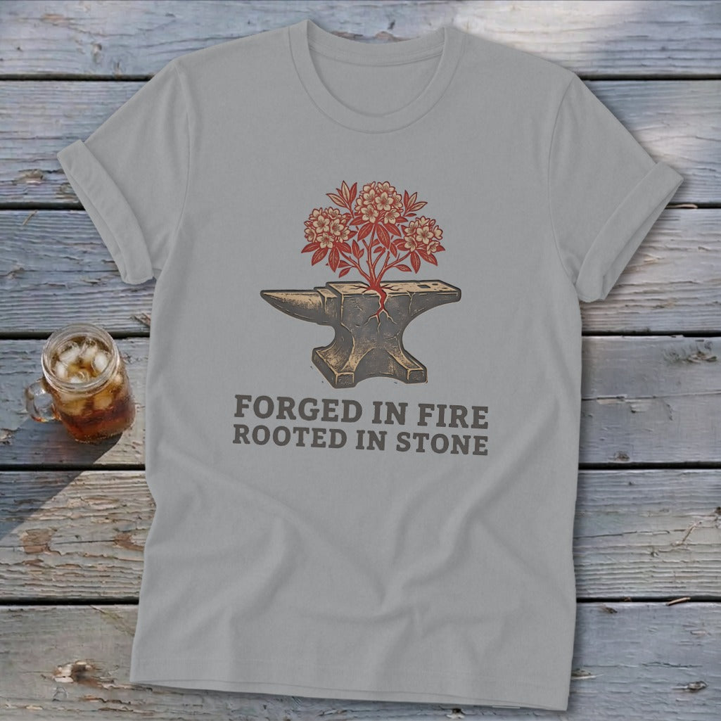 Gray t-shirt with anvil graphic and text: "FORGED IN FIRE ROOTED IN STONE".
