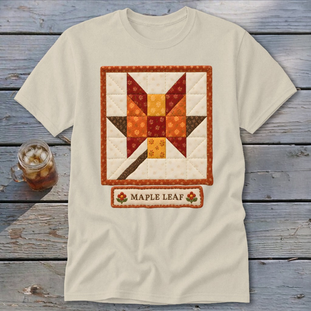 Cream t-shirt with a quilted maple leaf design and "MAPLE LEAF" text.