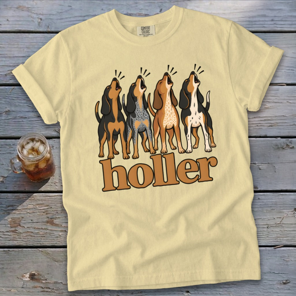 Light yellow t-shirt with four howling hounds and "holler" text.