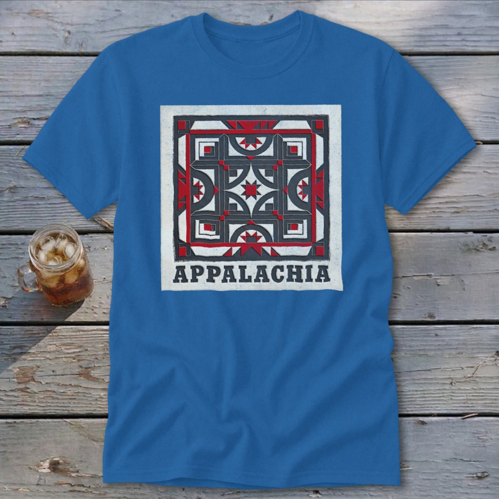 A blue t-shirt featuring a square quilt block design and the text Appalachia laid on wooden planks.
