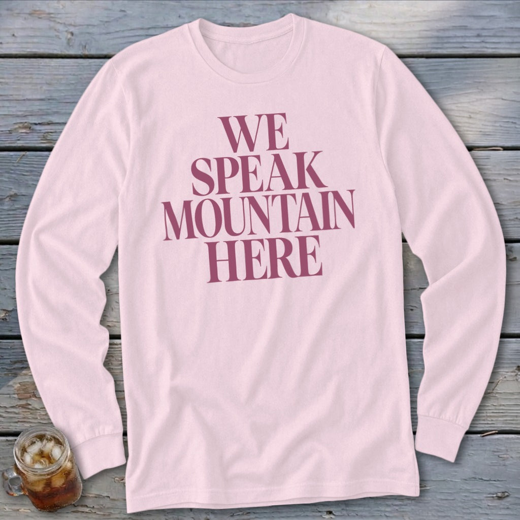 Pink long-sleeve shirt with "WE SPEAK MOUNTAIN HERE" text.