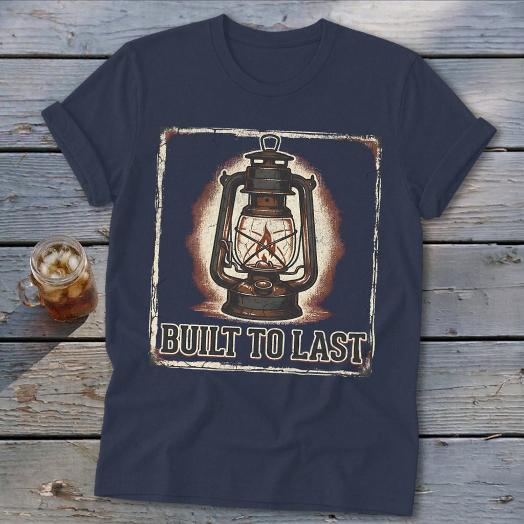 Navy t-shirt with distressed lantern graphic and "BUILT TO LAST" text.