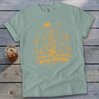 Sage green t-shirt with orange hiking graphic and text: "If you hear whistlin', keep hiking."