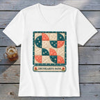 White t-shirt with a quilted "Drunkard's Path" pattern and text.