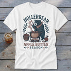 Bear making apple butter with "Hollerbear Apple Butter Season" text.