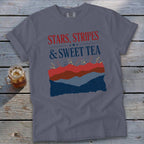 Blue t-shirt with "Stars, Stripes & Sweet Tea" and fireworks graphic.