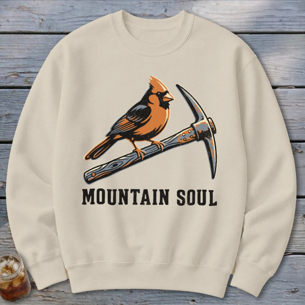 Cream sweatshirt with cardinal on pickaxe and "MOUNTAIN SOUL" text.