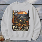 Autumn porch scene with rocking chairs, pumpkins, and text: "Pull up a chair, The holler's talkin'".