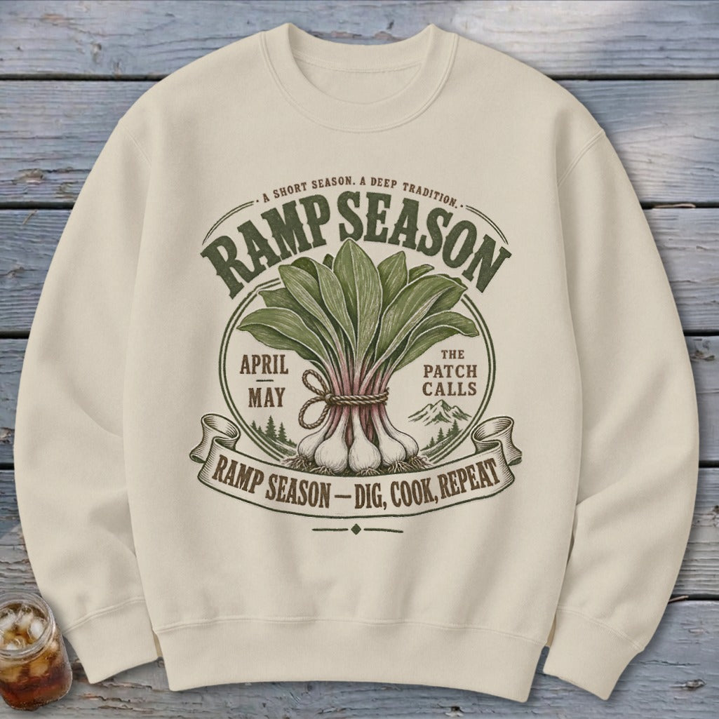 Cream sweatshirt with RAMP SEASON graphic featuring ramps, mountains, and text.