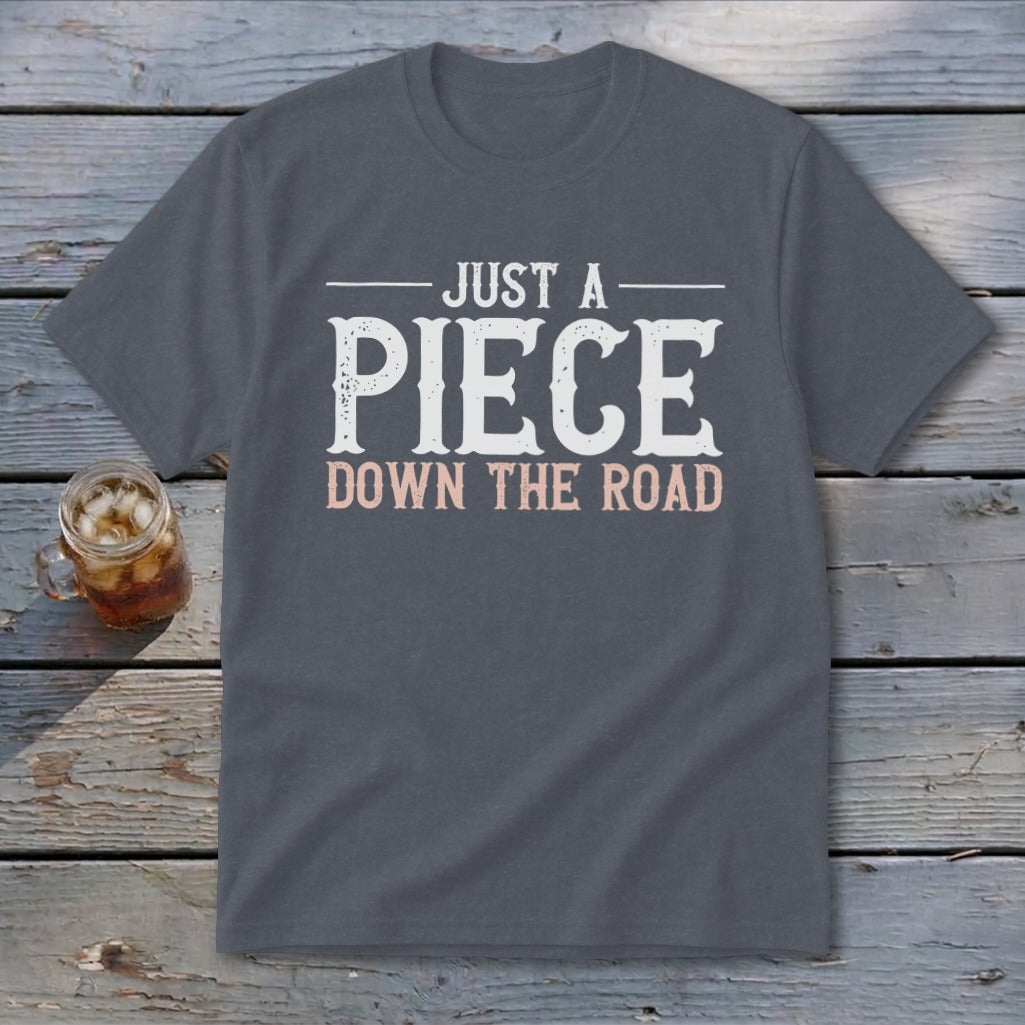 Gray t-shirt with text "JUST A PIECE DOWN THE ROAD".