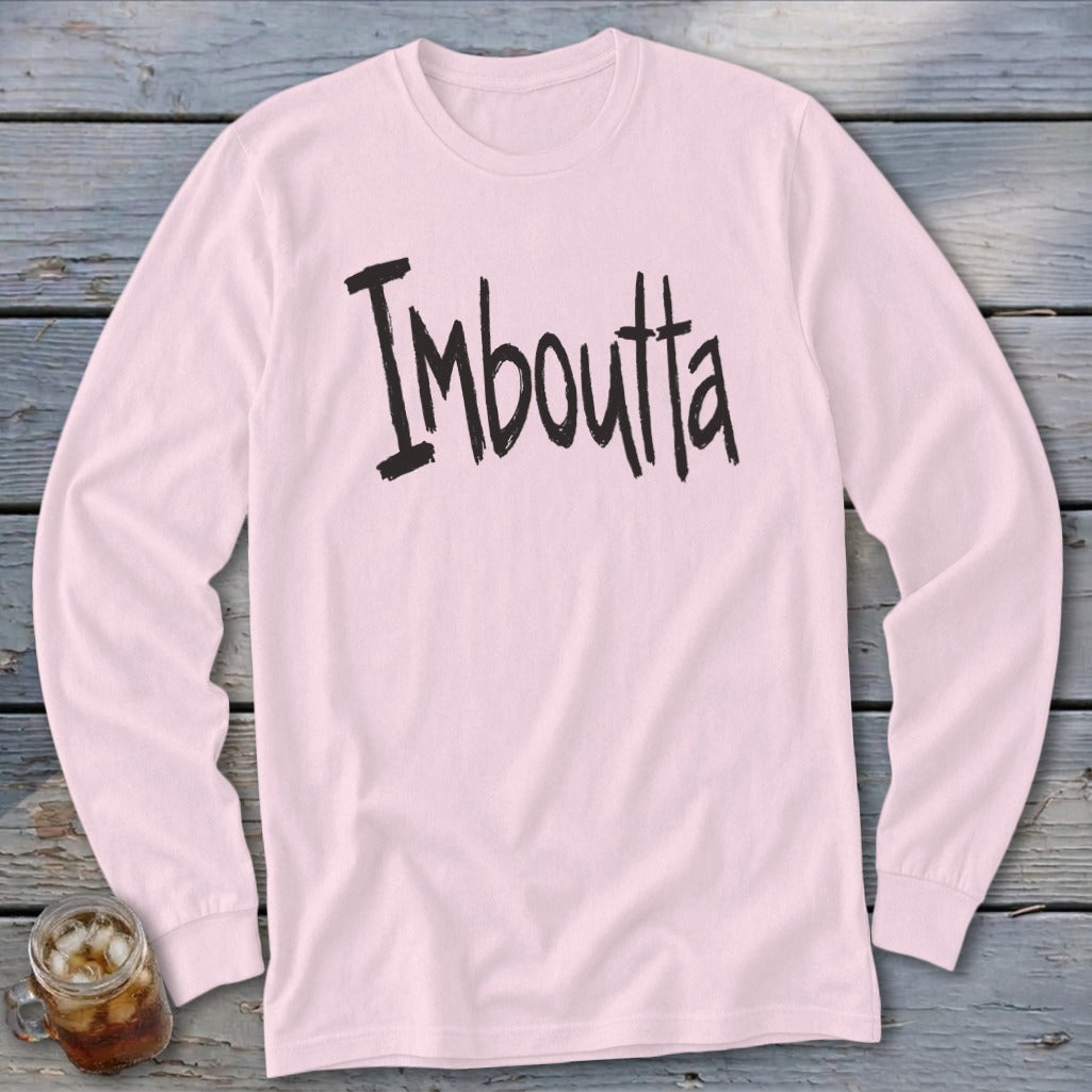 Pink long-sleeve shirt with black text "Imboutta" in distressed font.