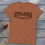 Brown t-shirt with "APPALACHIA #Pennsylvania" text and a glass of iced beverage.
