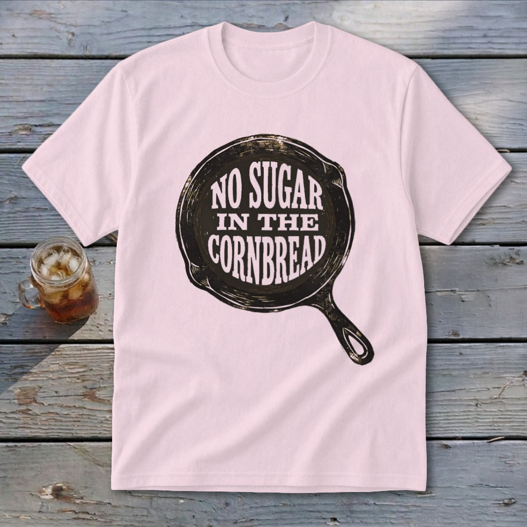 Pink t-shirt with graphic of cast iron skillet and text "No Sugar In The Cornbread".