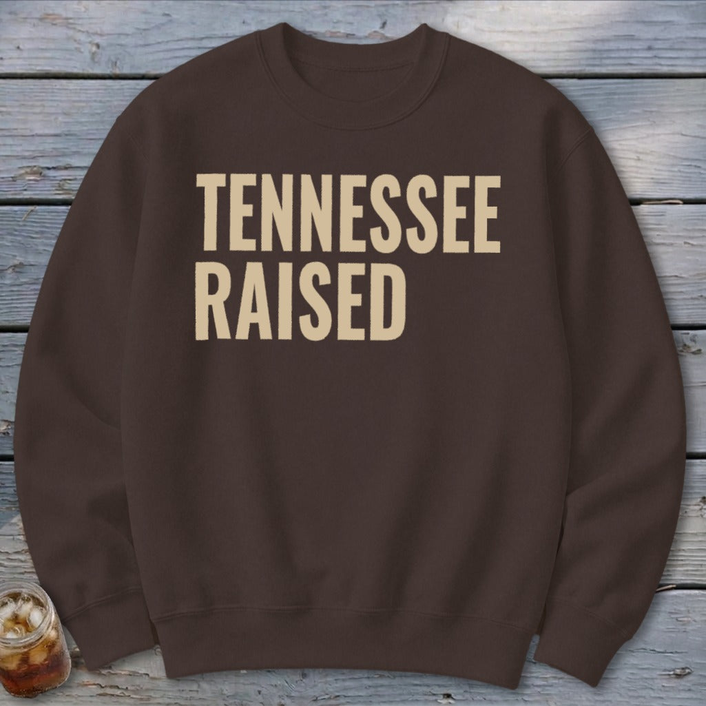 Brown sweatshirt with "TENNESSEE RAISED" text in beige.