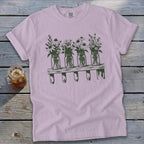 Light purple crewneck t-shirt featuring a green graphic of four mason jars with flowers on a shelf.