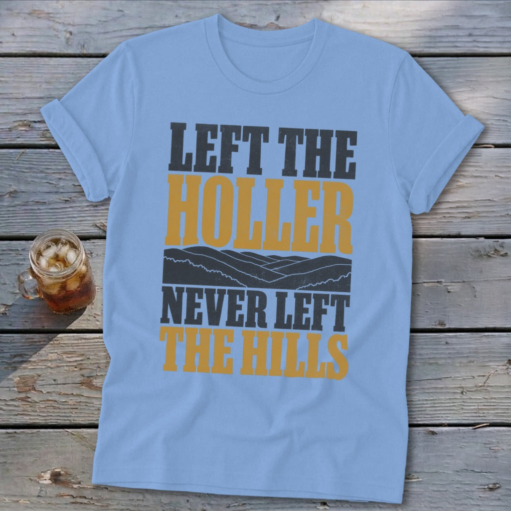 Light blue t-shirt with "LEFT THE HOLLER NEVER LEFT THE HILLS" text.