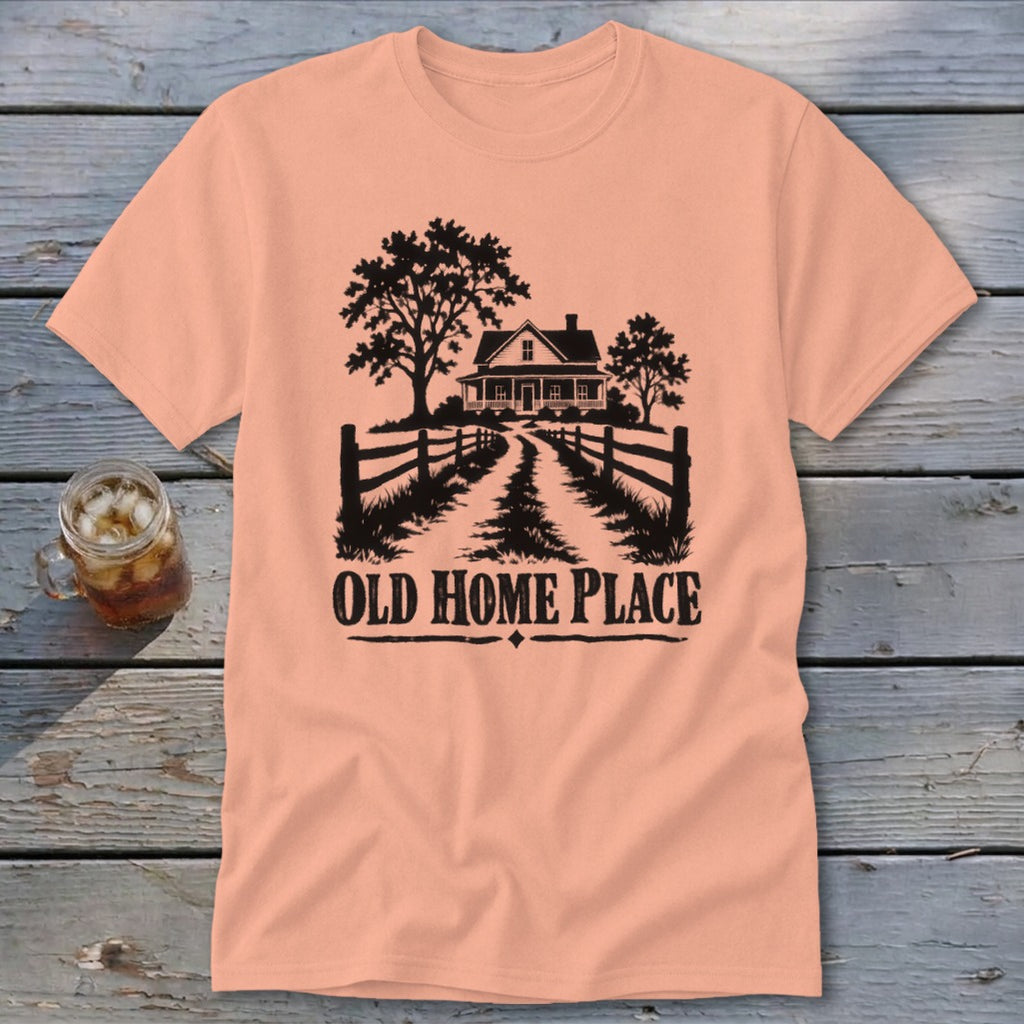 Peach t-shirt with black graphic of a farmhouse and path, reading "OLD HOME PLACE".
