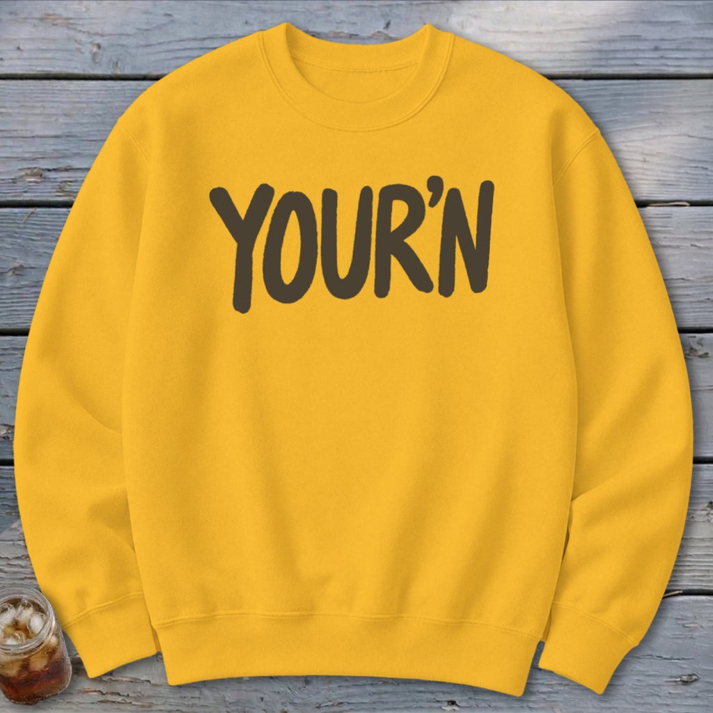 Yellow crewneck sweatshirt with "YOUR'N" printed in dark brown.