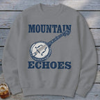 Gray crewneck sweatshirt featuring a blue graphic of a banjo and the text Mountain Echoes.