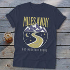 Navy t-shirt with "MILES AWAY BUT MOUNTAIN BOUND" text and mountain road graphic.