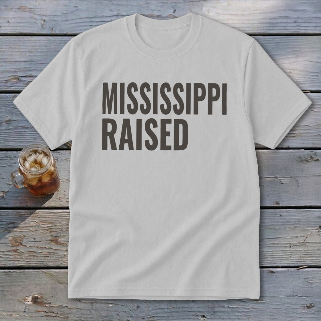 White t-shirt with "MISSISSIPPI RAISED" printed in dark gray.