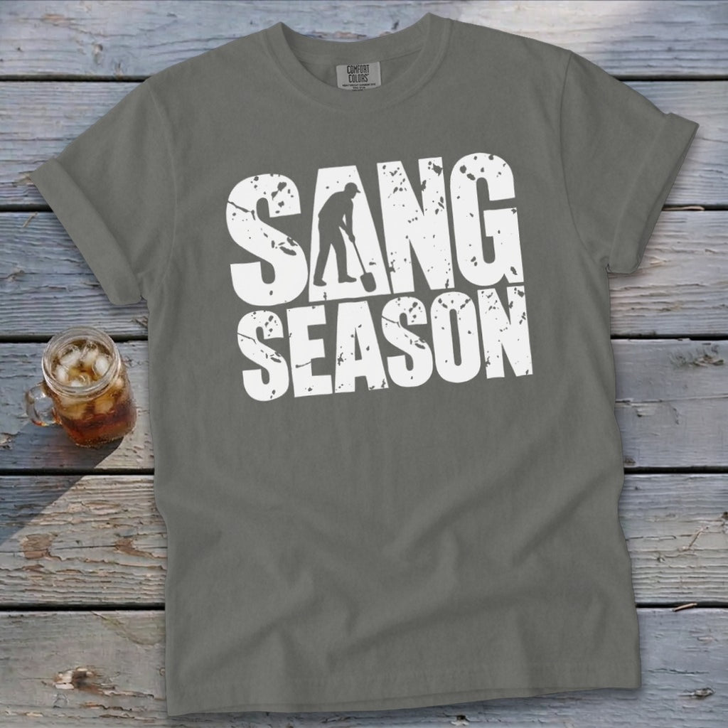 Gray short-sleeve t-shirt featuring the white distressed text SANG SEASON, with a silhouetted digger integrated into the lettering.