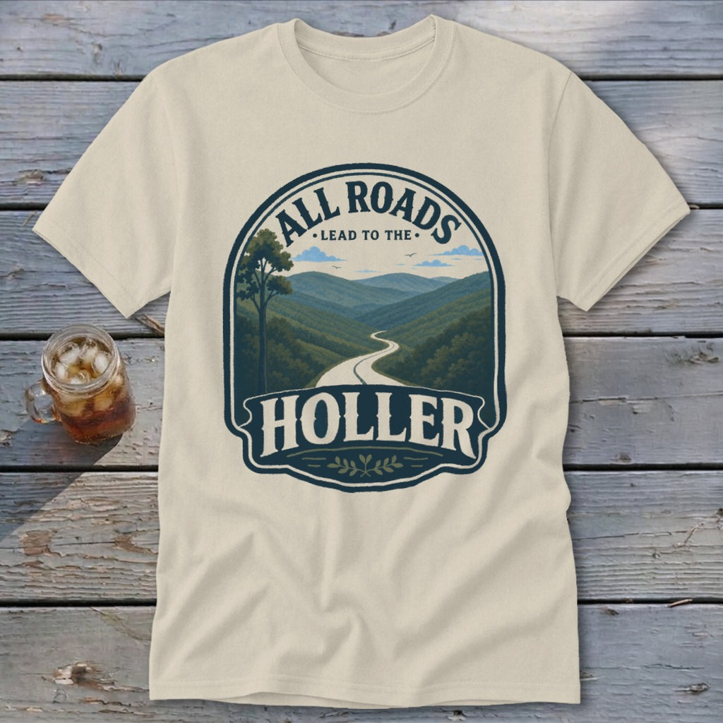 Cream t-shirt with graphic of a winding road through mountains and text "ALL ROADS LEAD TO THE HOLLER".