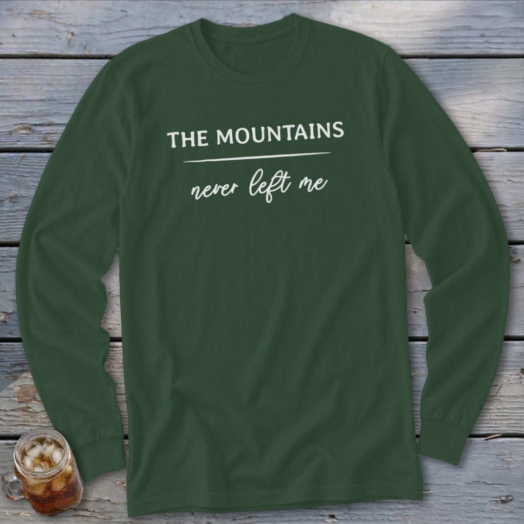 Dark green long sleeve shirt with "The Mountains never left me" text.