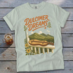Light blue t-shirt with "Dulcimer Dreams" graphic and mountain landscape.