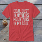 Red short-sleeve t-shirt with the white distressed text Coal Dust in My Veins Mountains in My Soul.