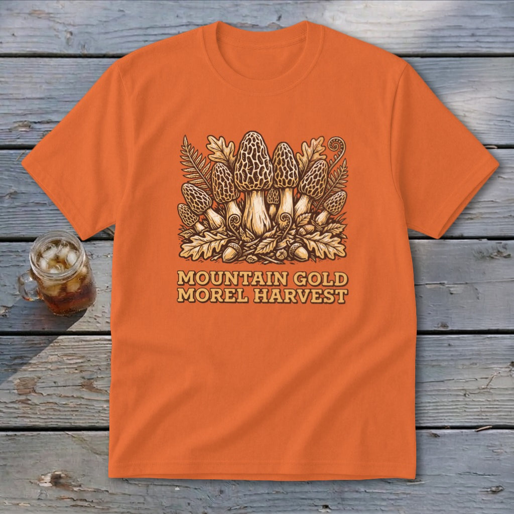 Orange t-shirt with "Mountain Gold Morel Harvest" text and morel mushroom graphic.