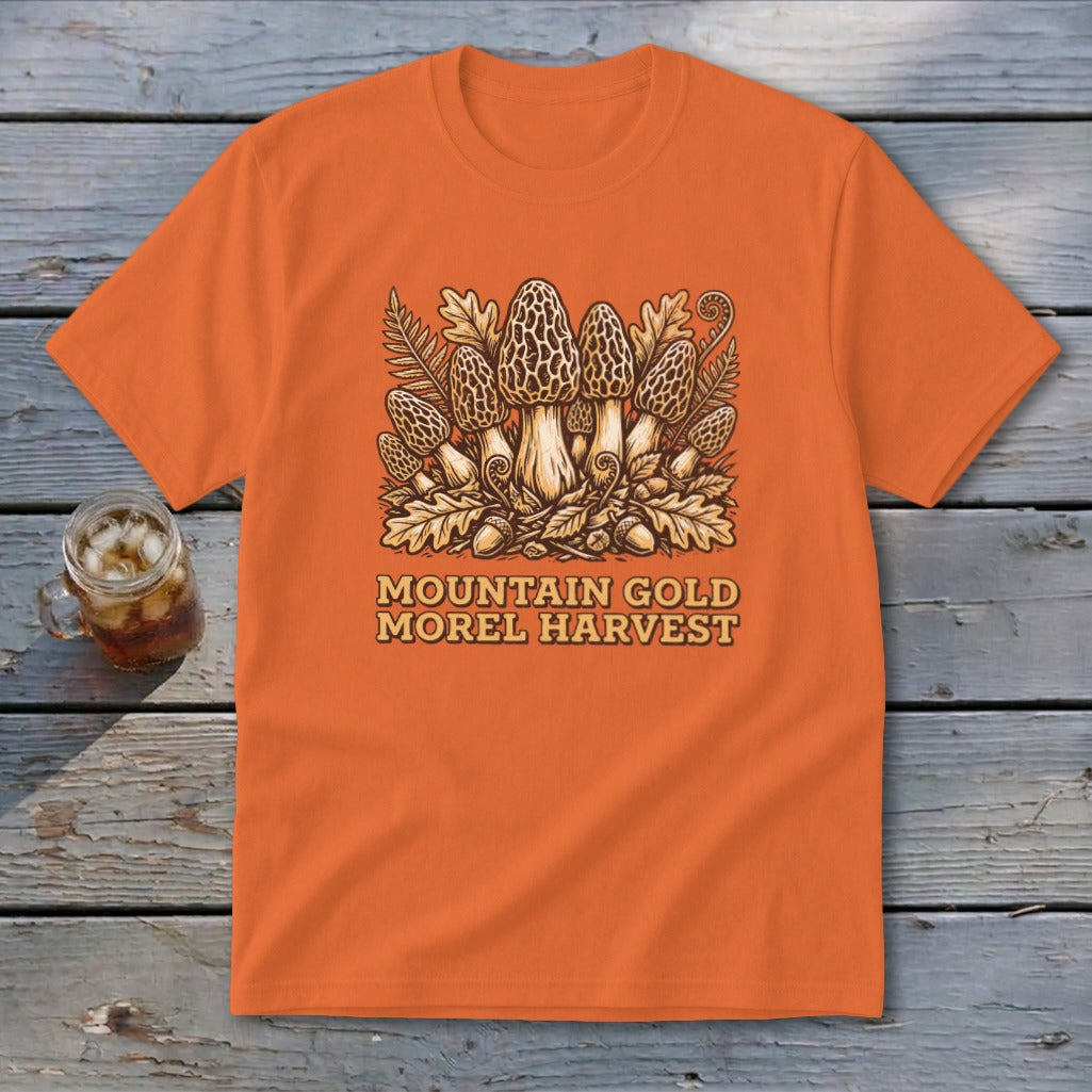 Orange t-shirt with "Mountain Gold Morel Harvest" text and morel mushroom graphic.