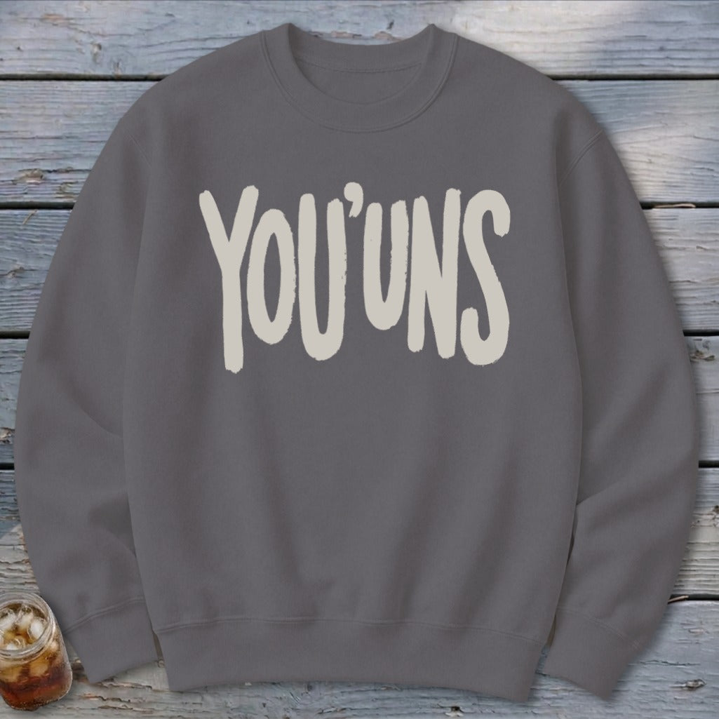 Grey crewneck sweatshirt with "YOU'UNS" in large cream-colored lettering.