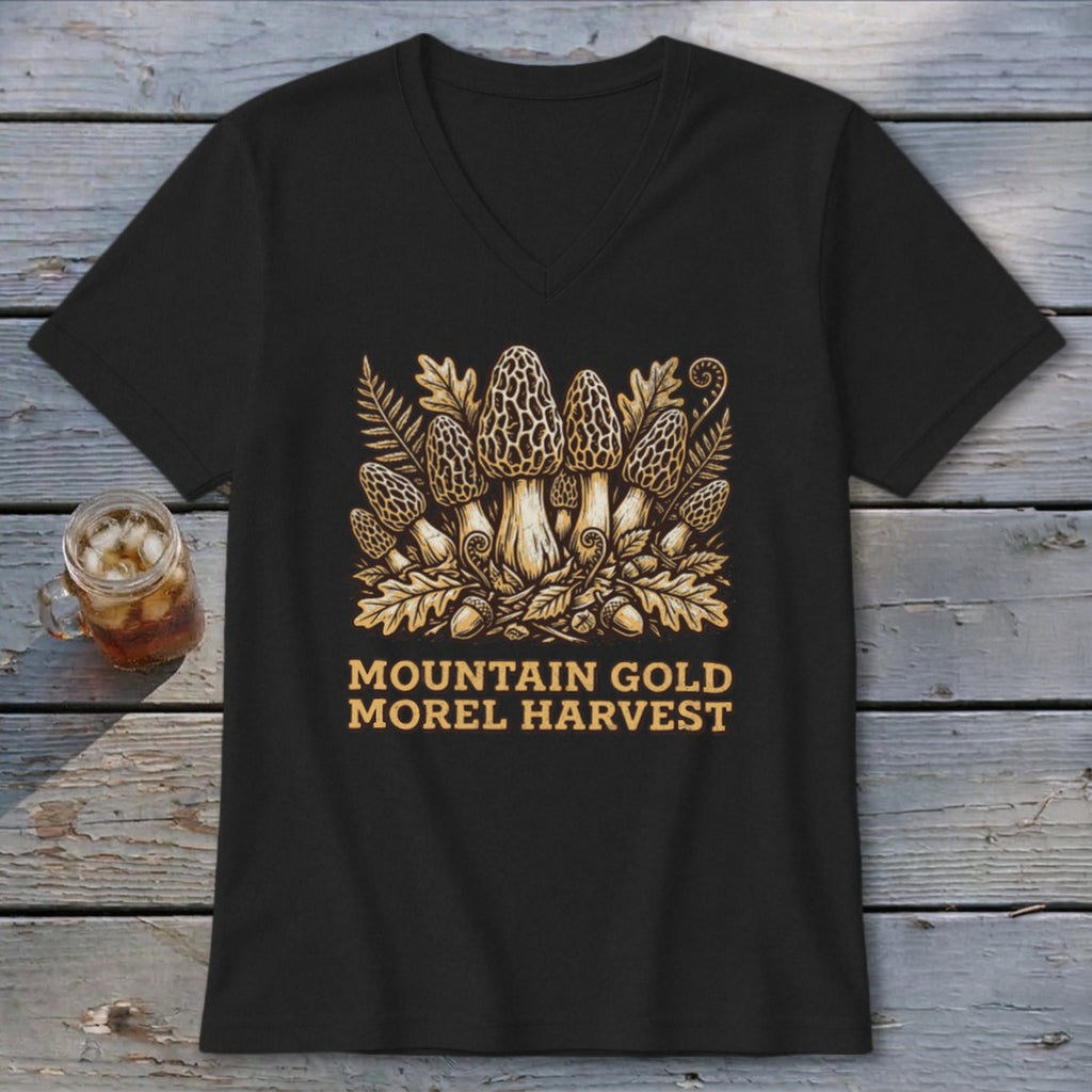 Black t-shirt with gold morel mushrooms, ferns, and acorns design and text.
