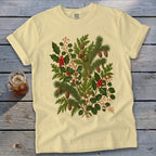 Pale yellow t-shirt with a detailed botanical print of holly, pine, and berries.