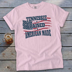 Pink t-shirt with distressed American flag and "Tennessee Raised American Made" text.